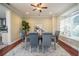 Charming dining room with a ceiling fan and a bay window featuring comfortable seating at 4808 Juliana Reserve Dr, Auburndale, FL 33823