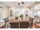 Cozy dining room with hardwood floors, a traditional chandelier and an entrance to the kitchen at 4808 Juliana Reserve Dr, Auburndale, FL 33823