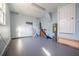 Well-lit garage with storage shelves, providing functionality and ample space for parking or hobbies at 4808 Juliana Reserve Dr, Auburndale, FL 33823