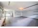 Large and clean garage space with a high ceiling, storage, and versatile potential for various uses at 4808 Juliana Reserve Dr, Auburndale, FL 33823