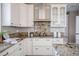 Elegant kitchen featuring custom cabinets, granite countertops, and modern appliances at 4808 Juliana Reserve Dr, Auburndale, FL 33823
