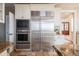 Bright kitchen features stainless steel appliances including a large refrigerator and a built-in microwave and oven at 4808 Juliana Reserve Dr, Auburndale, FL 33823