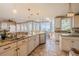Bright kitchen featuring granite countertops, stainless steel appliances, and a stunning water view at 4808 Juliana Reserve Dr, Auburndale, FL 33823