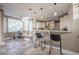 Well lit kitchen with bar stool seating overlooks the breakfast nook and backyard at 4808 Juliana Reserve Dr, Auburndale, FL 33823