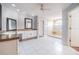 Large main bathroom featuring dual vanities, a walk-in shower, and bright white tile floors at 4808 Juliana Reserve Dr, Auburndale, FL 33823