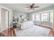 Relaxing bedroom with a bay window providing natural light and hardwood floors at 4808 Juliana Reserve Dr, Auburndale, FL 33823