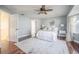 Stylish bedroom with a bay window, ceiling fan, and hardwood floors, providing comfort and elegance at 4808 Juliana Reserve Dr, Auburndale, FL 33823