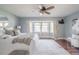 Bright main bedroom with a bay window and wood floors, creating a serene and welcoming atmosphere at 4808 Juliana Reserve Dr, Auburndale, FL 33823