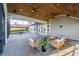 Screened in patio featuring pavers, ceiling fans, and outdoor furniture for luxurious outdoor living and entertaining at 4808 Juliana Reserve Dr, Auburndale, FL 33823