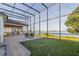 Spacious screened patio with outdoor dining and lounge areas offers beautiful views of the water at 4808 Juliana Reserve Dr, Auburndale, FL 33823