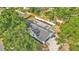 An aerial view of a modern house with a well-manicured lawn and a unique outdoor space at 4825 Foxrun, Lakeland, FL 33813