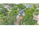An aerial view of a home with mature trees and a spacious driveway, perfect for Gathering living at 4825 Foxrun, Lakeland, FL 33813