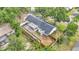 An aerial view showcases this well-maintained home with lush landscaping and privacy fence at 4825 Foxrun, Lakeland, FL 33813