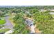 An aerial view of a modern home with beautiful landscaping and a large backyard at 4825 Foxrun, Lakeland, FL 33813