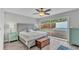 Light-filled bedroom with sliding glass doors, a ceiling fan, and gray walls at 4825 Foxrun, Lakeland, FL 33813