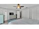 A well-lit bedroom featuring a large bed, soft rug, and dual closets at 4825 Foxrun, Lakeland, FL 33813