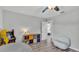 Bedroom featuring a ceiling fan, wood floors, and neutral walls at 4825 Foxrun, Lakeland, FL 33813