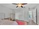 Bedroom featuring a ceiling fan, closet, wood floors, and neutral walls at 4825 Foxrun, Lakeland, FL 33813