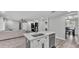 Open kitchen overlooking the living room, featuring an island with seating and stainless steel appliances at 4825 Foxrun, Lakeland, FL 33813