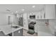 Contemporary kitchen boasts stainless steel appliances, island, and bright countertops at 4825 Foxrun, Lakeland, FL 33813