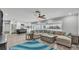 Open living space showcases modern kitchen and spacious seating area with natural light at 4825 Foxrun, Lakeland, FL 33813