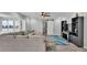 Bright living area features a stylish ceiling fan, sectional sofa, and barn door at 4825 Foxrun, Lakeland, FL 33813