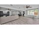 Open-concept living area combines kitchen, living room, and sunroom for easy entertaining at 4825 Foxrun, Lakeland, FL 33813