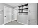 This mud room features speckled floors, sleek shelving, and ample storage at 4825 Foxrun, Lakeland, FL 33813