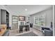 Spacious home office featuring built-in shelves, a window, and dark desk at 4825 Foxrun, Lakeland, FL 33813