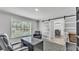 Home office space with large window and sliding door to the dining room at 4825 Foxrun, Lakeland, FL 33813