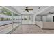 Relaxing sun room with floor-to-ceiling windows offers seamless indoor-outdoor living at 4825 Foxrun, Lakeland, FL 33813