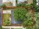 Aerial view of the property showing the house layout, mature trees, and surrounding landscape at 509 Rob Roy St, Lakeland, FL 33813