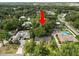 Aerial view of the property highlighting the home's location, backyard trees and proximity to neighborhood at 509 Rob Roy St, Lakeland, FL 33813
