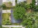 Aerial view of the property with mature trees and the home's layout at 509 Rob Roy St, Lakeland, FL 33813