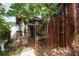 Exterior view of a back porch area with brick flooring and mature trees at 509 Rob Roy St, Lakeland, FL 33813