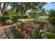 Backyard view showcasing the garden area with brick-lined planters and greenery at 509 Rob Roy St, Lakeland, FL 33813