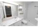 Bright bathroom featuring a sleek vanity, walk-in shower, and natural light at 509 Rob Roy St, Lakeland, FL 33813