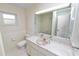 This bathroom has tile flooring and walls, vanity, and shower at 509 Rob Roy St, Lakeland, FL 33813