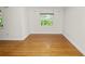 Bright bedroom with hardwood floors, neutral walls and a large window at 509 Rob Roy St, Lakeland, FL 33813