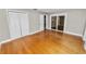 Large bedroom with closet, sliding glass doors, and hardwood floors at 509 Rob Roy St, Lakeland, FL 33813