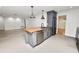 Spacious kitchen features stylish island, granite countertops, stainless steel appliances and an open layout at 509 Rob Roy St, Lakeland, FL 33813