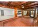 Spacious sun room featuring brick floors with backyard and kitchen access at 509 Rob Roy St, Lakeland, FL 33813