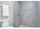 Updated bathroom showcasing tiled shower and toilet at 5163 Spanish Oaks Dr, Lakeland, FL 33805