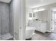Bright bathroom featuring a double vanity, shower, and freestanding tub at 5163 Spanish Oaks Dr, Lakeland, FL 33805