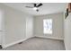 Bedroom with carpet, fan and one window allowing ample natural light at 5163 Spanish Oaks Dr, Lakeland, FL 33805