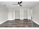 Spacious bedroom featuring dual closets and modern ceiling fan at 5163 Spanish Oaks Dr, Lakeland, FL 33805