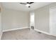 Bedroom with carpet, fan and neutral paint and trim at 5163 Spanish Oaks Dr, Lakeland, FL 33805