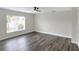 Bedroom featuring large window providing natural light at 5163 Spanish Oaks Dr, Lakeland, FL 33805