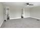 Spacious bedroom featuring carpet, ceiling fan, and en suite bathroom with tub at 5163 Spanish Oaks Dr, Lakeland, FL 33805
