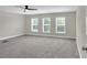 Bright bedroom with three large windows and a ceiling fan at 5163 Spanish Oaks Dr, Lakeland, FL 33805